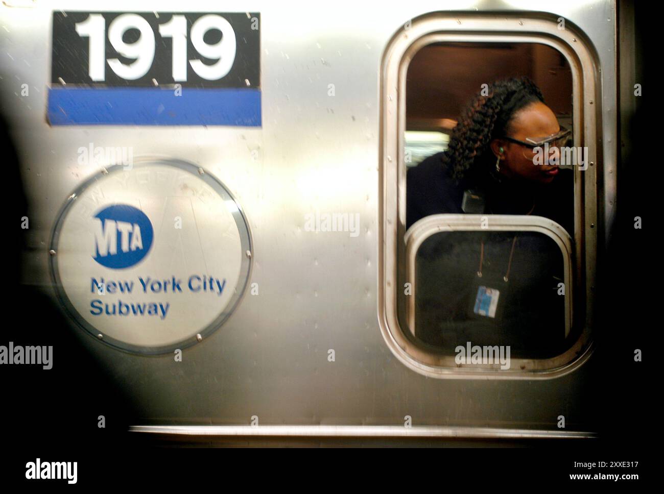 New-Yorkais sur la ligne de métro 1/9 de Manhattan. Lorsqu'ils ont parlé aux passagers, ils ont répondu qu'ils étaient plus préoccupés par la météo ou par le fait d'être agressés que par le risque d'être la cible de terroristes. Banque D'Images