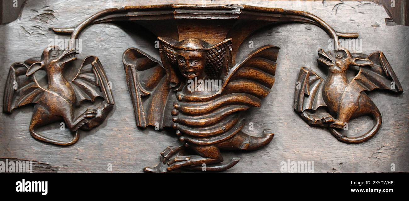 Miséricord dans l'église paroissiale de St Laurence, Ludlow, Shropshire, Angleterre, Royaume-Uni - énigmatique Banque D'Images