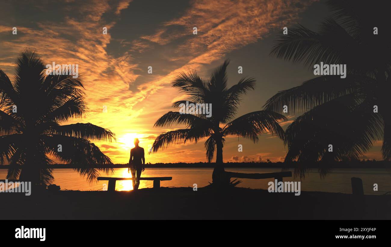 Silhouette d'une jeune femme debout entre des palmiers, admirant un beau coucher de soleil sur le lagon de l'île de maupiti en polynésie française Banque D'Images