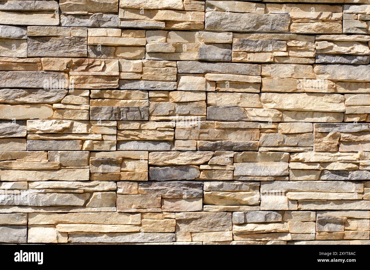 Texture de mur en pierre naturelle – arrière-plan détaillé de la pierre empilée Banque D'Images