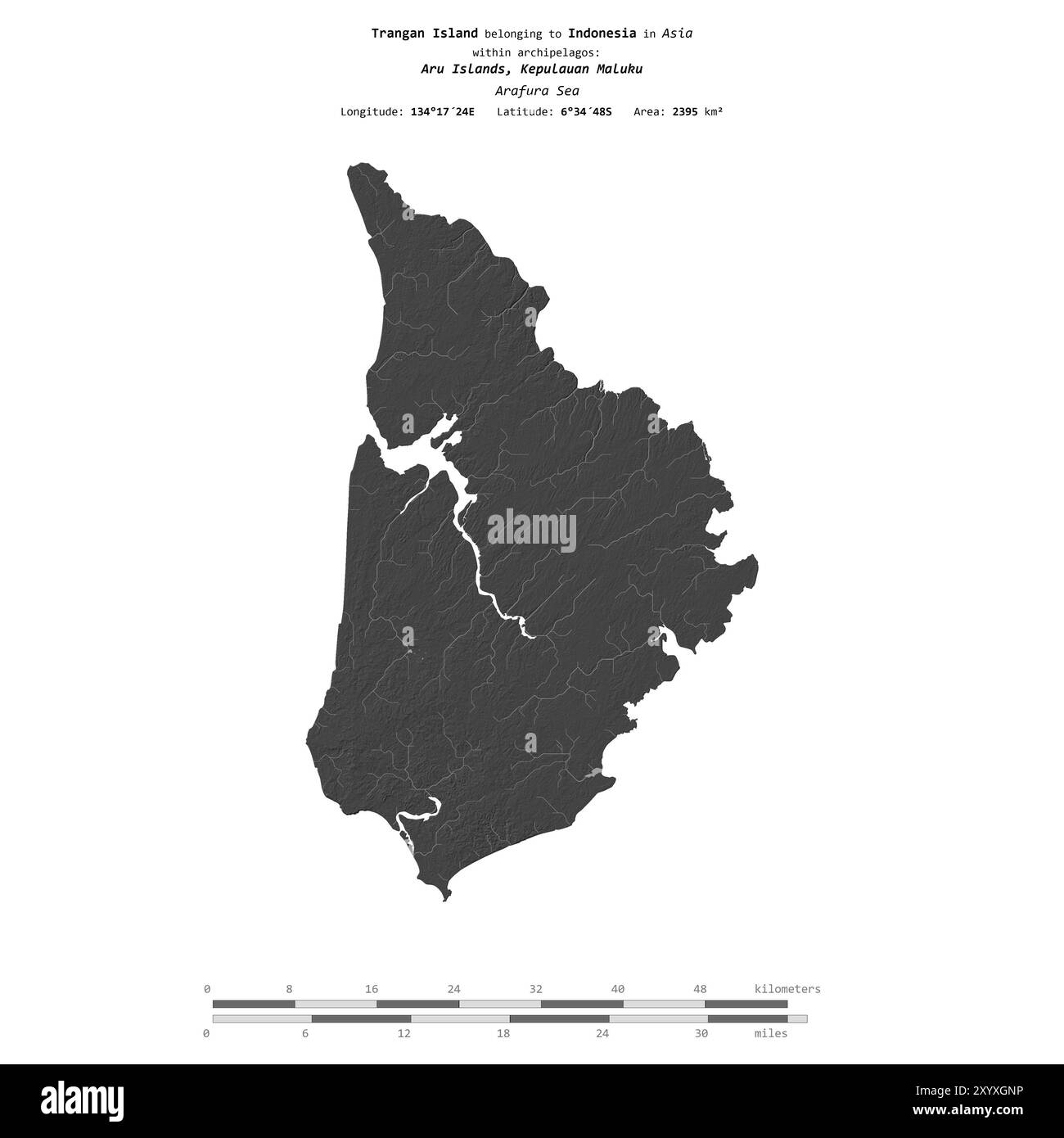 Île de Trangan dans la mer d'Arafura, appartenant à l'Indonésie, isolée sur une carte d'altitude à deux niveaux, avec échelle de distance Banque D'Images