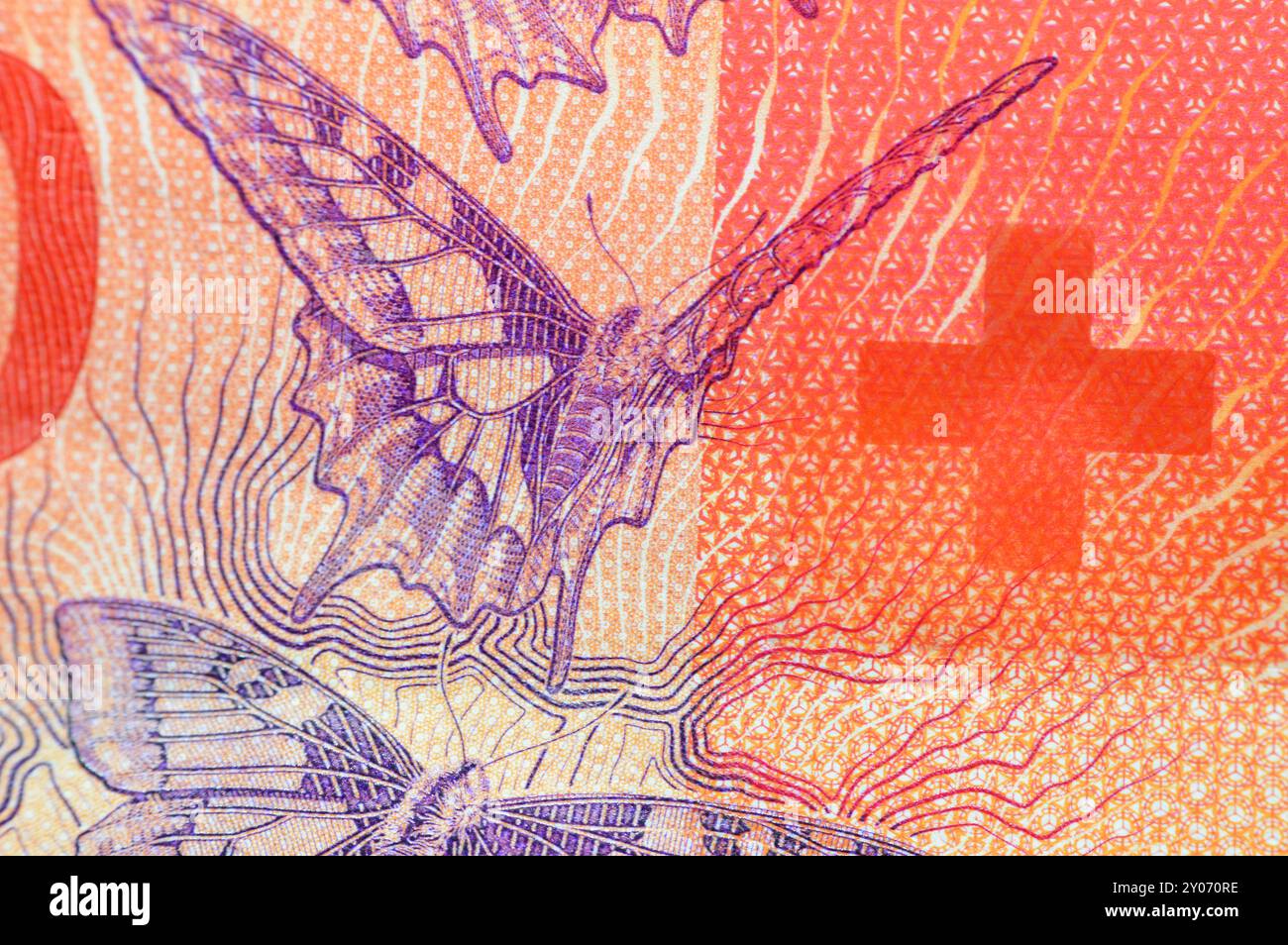 Un gros plan de la Suisse 20 vingt francs, des papillons, une lumière projetée sur un écran, des lignes d'iris de l'œil humain, une main, une bande de sécurité, des émissions de lumière ma Banque D'Images