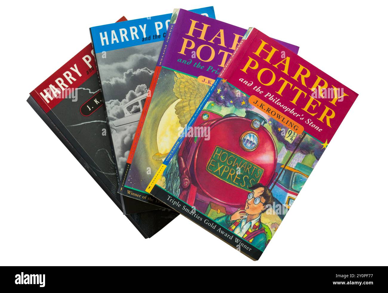 Sélection de livres Harry Potter par JK Rowling avec Harry Potter et le livre Philosopher's Stone sur le dessus isolé sur fond blanc Banque D'Images