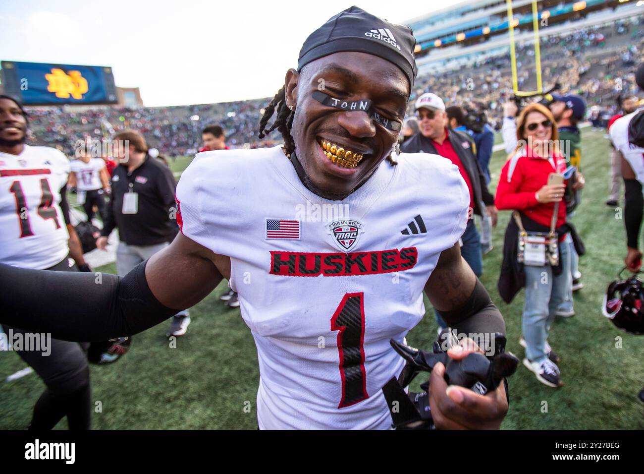 Northern Illinois defensive back Jashon Prophete (1) show off his gold teeth as he celebrates after an NCAA college football game against Notre Dame, Saturday, Sept. 7, 2024, in South Bend, Ind. (AP Photo/Michael Caterina) Banque D'Images