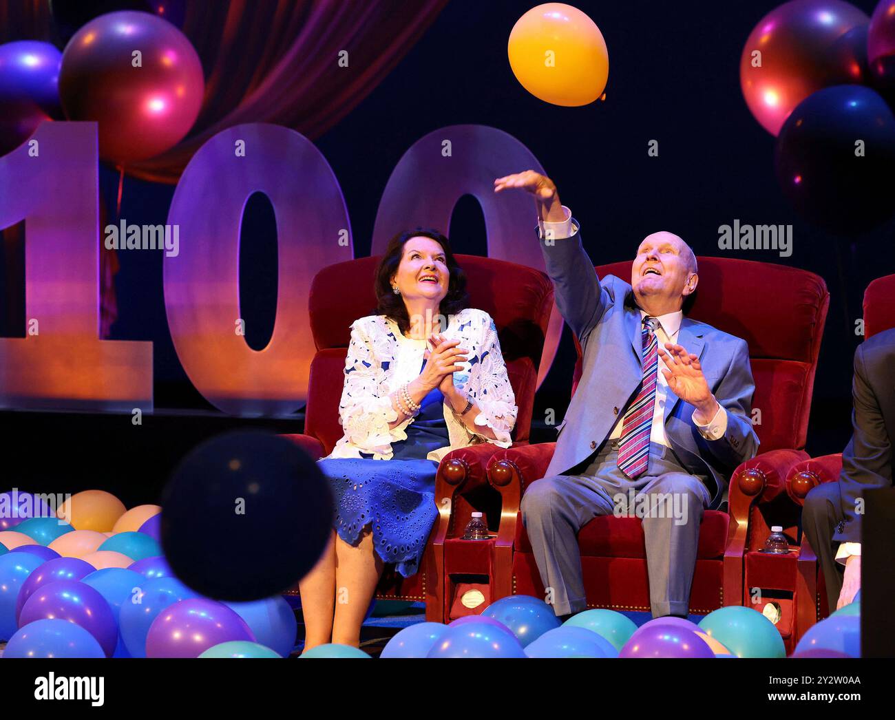 President Russell M. Nelson of The Church of Jesus Christ of Latter-day Saints and his wife Sister Wendy Nelson play with balloons during his 100th birthday celebration at the Little Theatre of the Conference Center in Salt Lake City, Monday, Sept. 9, 2024. (Jeffrey D. Allred/The Deseret News via AP, Pool) Banque D'Images