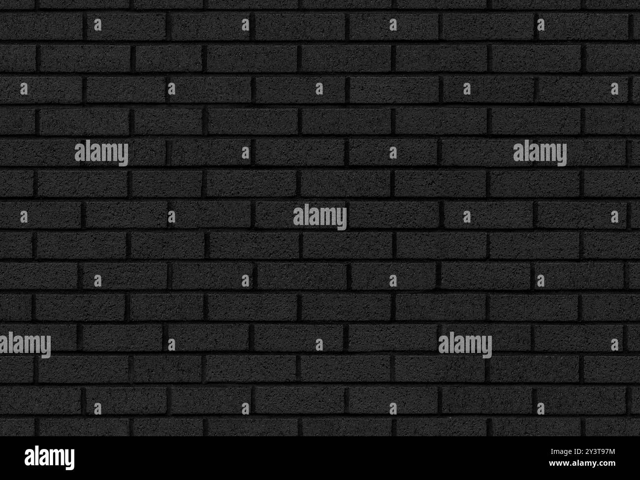 Mur de briques peint comme texture de fond noir dans un motif sans couture pour un fond sombre Banque D'Images