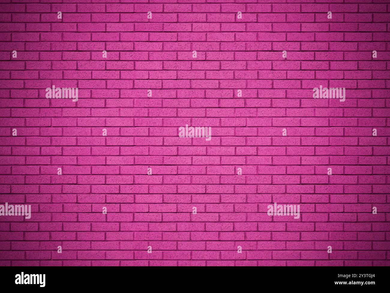 Surface de fond de mur de briques grunge de couleur rose. Projecteur sur la texture de fond architecturale peinte. Banque D'Images