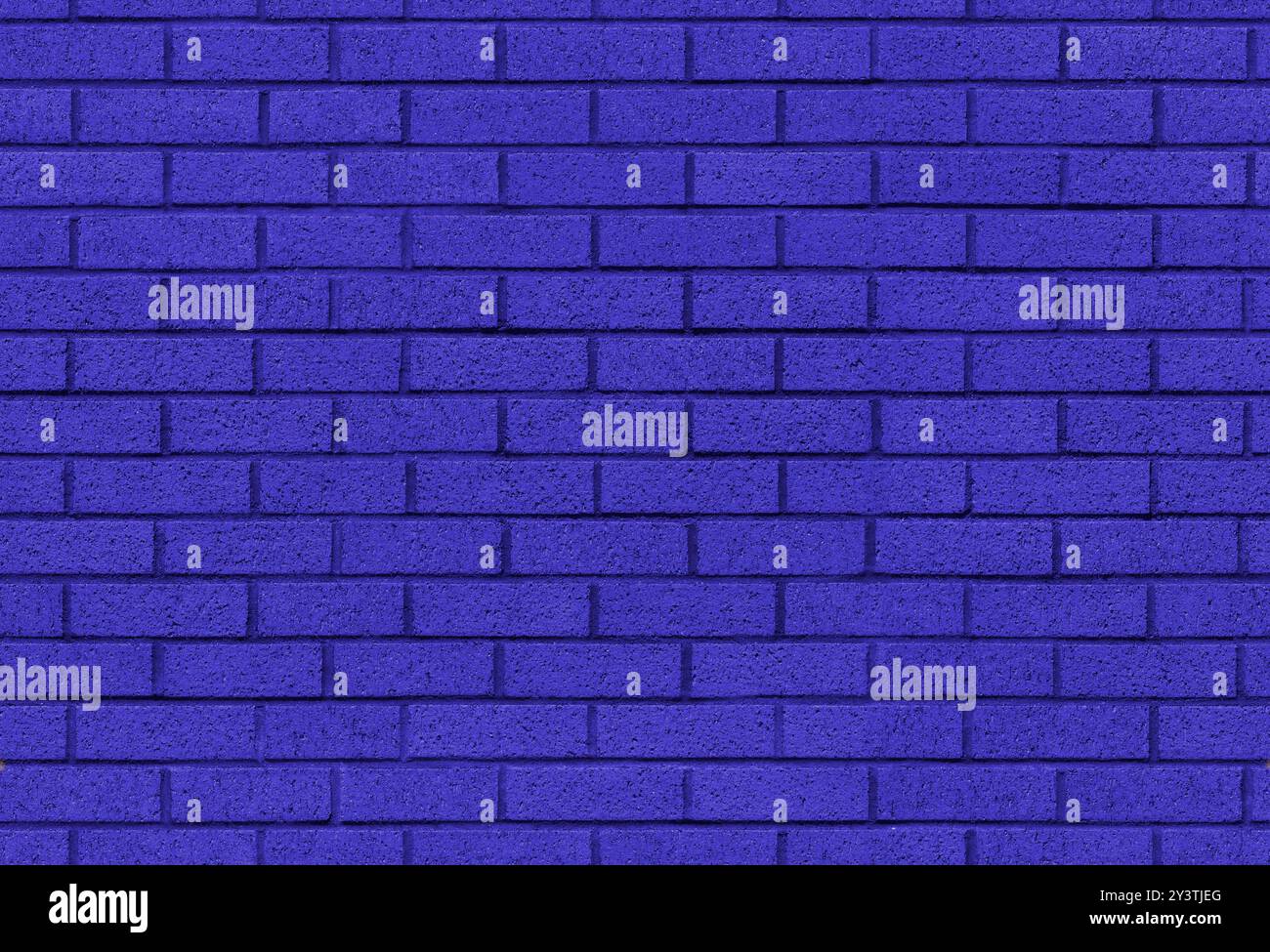 Image de texture de fond sans couture de mur de brique d'Indigo. peinture violette appliquée sur la surface de maçonnerie de bloc. Un intérieur moderne et extérieur et tuile de toile de fond. Banque D'Images