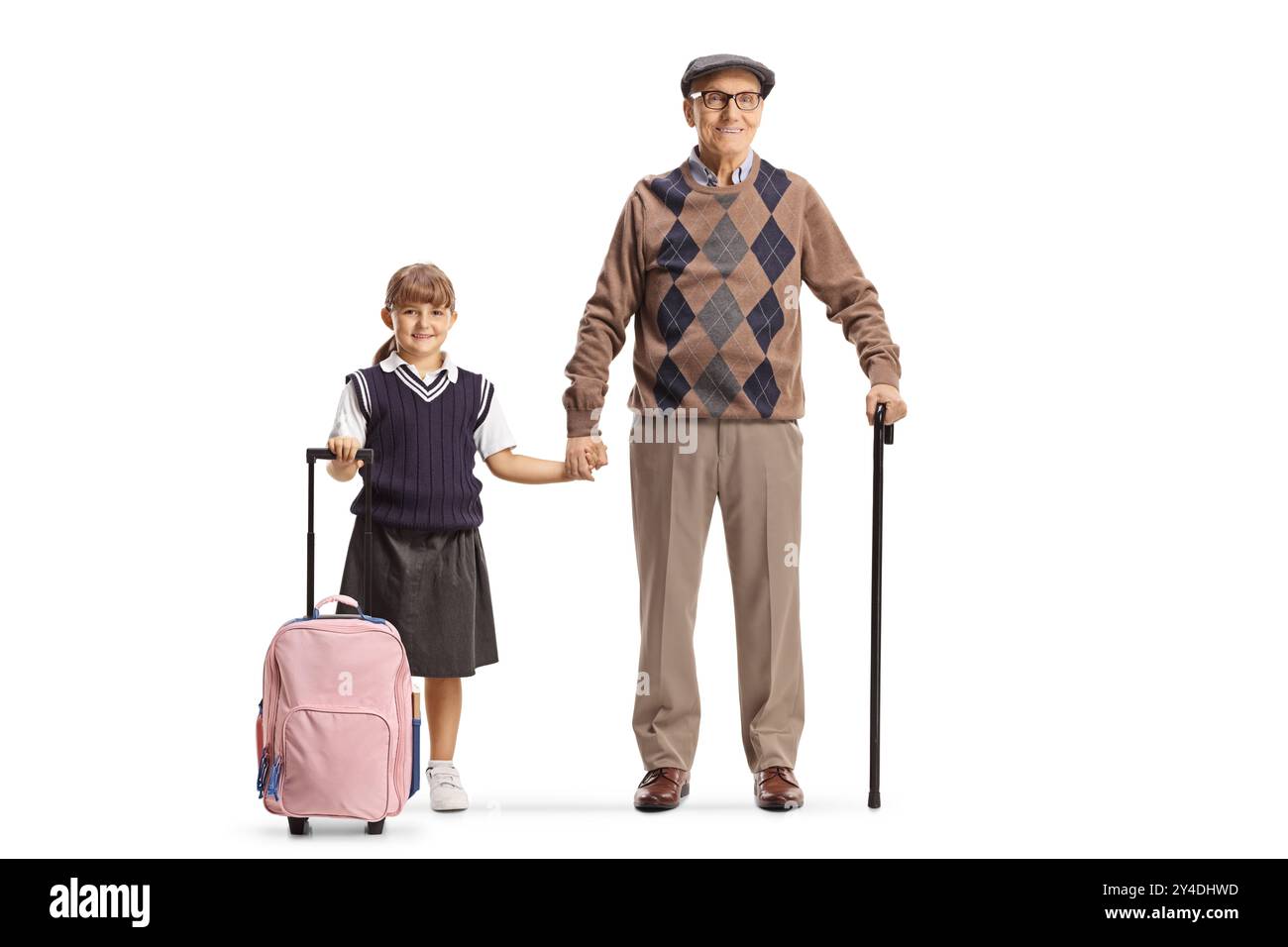 Écolière avec un sac à dos tenant les mains avec grand-père isolé sur fond blanc Banque D'Images