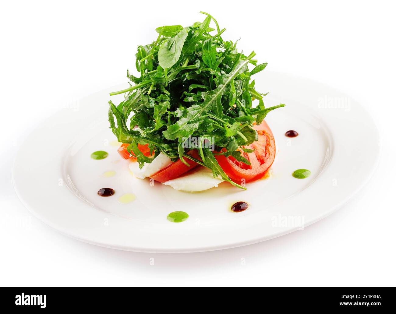 Salade verte avec roquette, tomate et fromage feta Banque D'Images