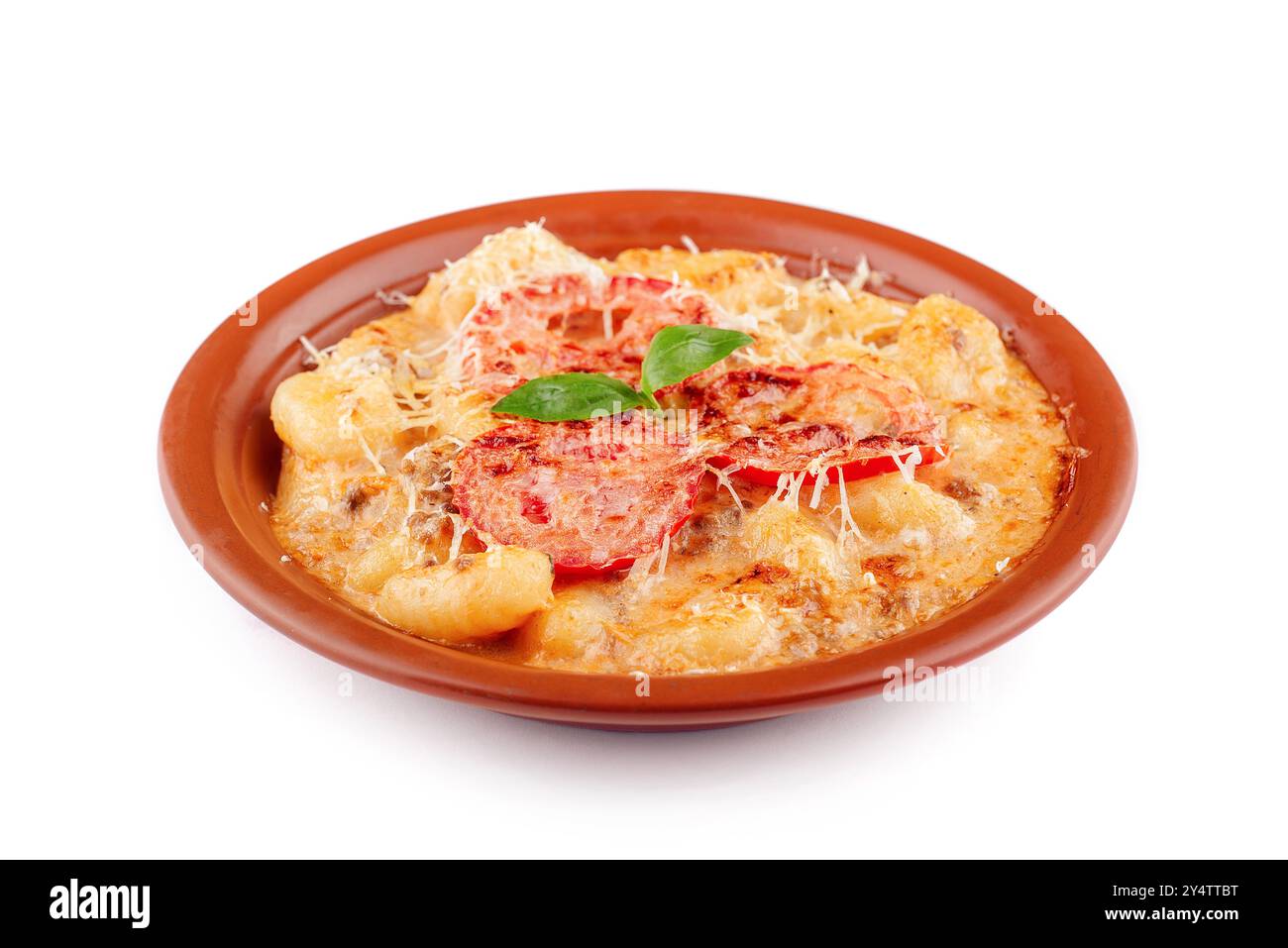 Délicieux plat de gnocchi italien avec fromage fondu et tomate sur une assiette Banque D'Images