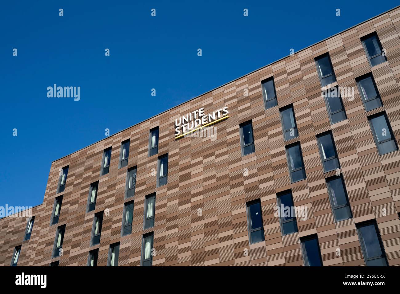 Vue générale d'une résidence Unite Students à l'Université de Newcastle avec le logo Unite Students affiché sous forme de signe par une journée ensoleillée. Banque D'Images
