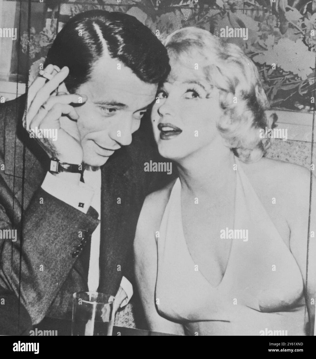 Marilyn Monroe and Yves Montand at a press conference for Let's Make Love , 1960