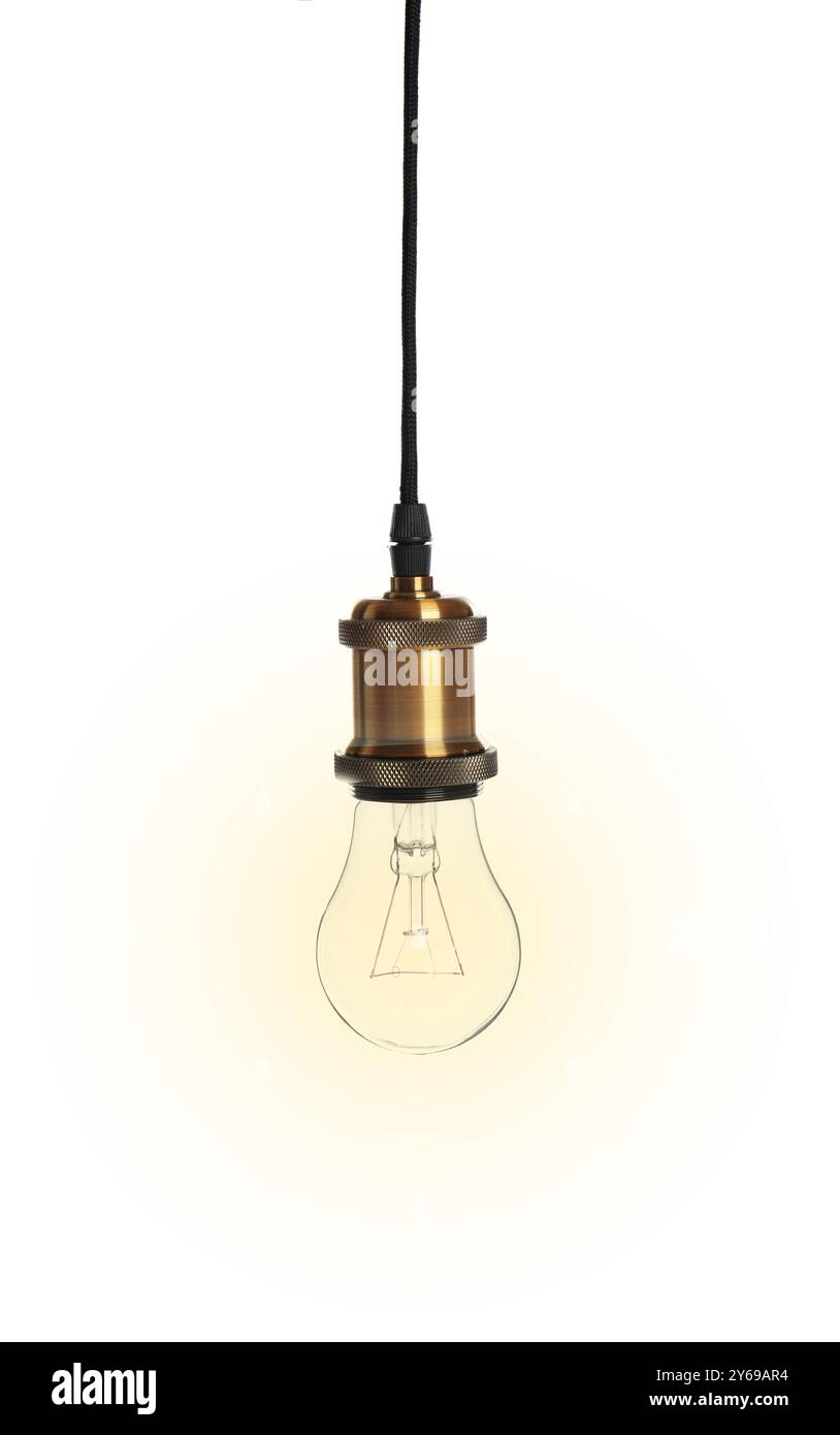Une ampoule lumineuse incandescente suspendue sur fond blanc Banque D'Images