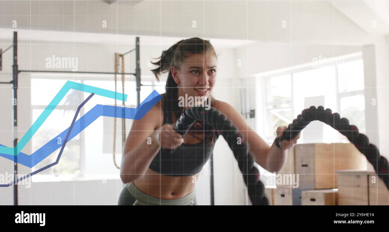 Exercice avec des cordes de combat, femme sur l'image graphique de données dans le gymnase Banque D'Images