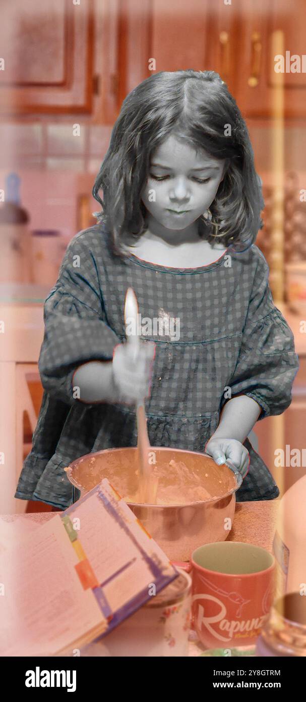 Une fille en noir et blanc faisant de la nourriture, tandis que la toile de fond est tout dans une couleur de type rouge Banque D'Images