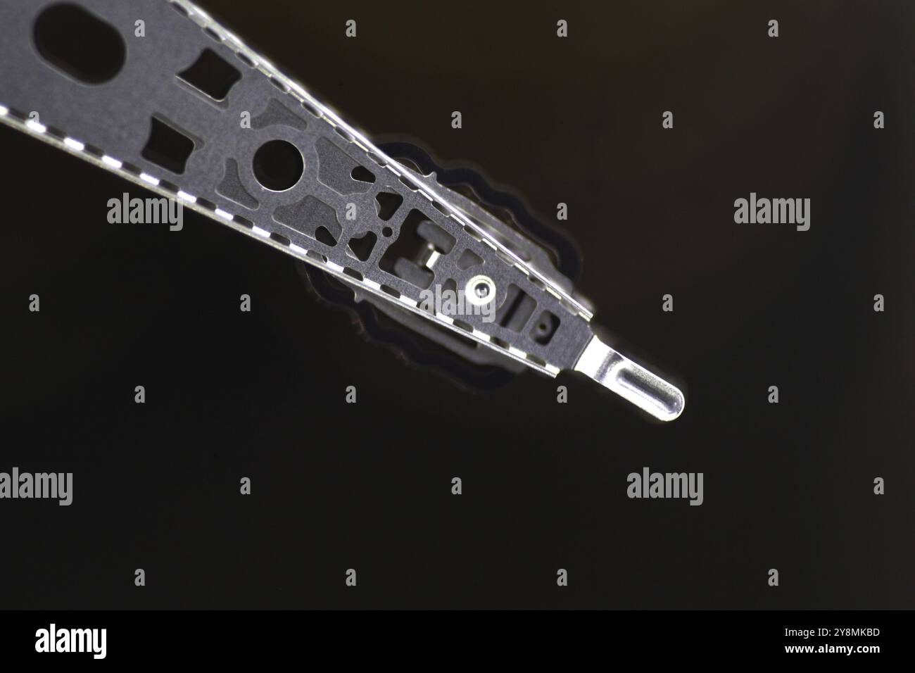 Macrophoto d'un bras d'actionnement d'un disque dur Banque D'Images