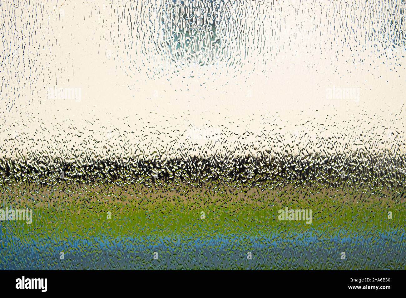 Fond abstrait pris à travers le verre à motifs Banque D'Images