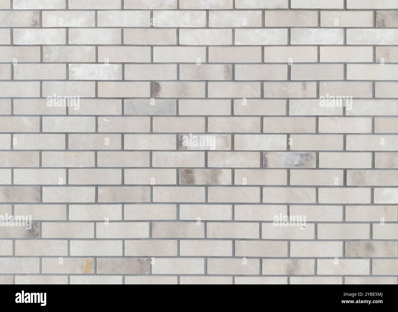 Mur de briques grises avec de subtiles variations de texture Banque D'Images