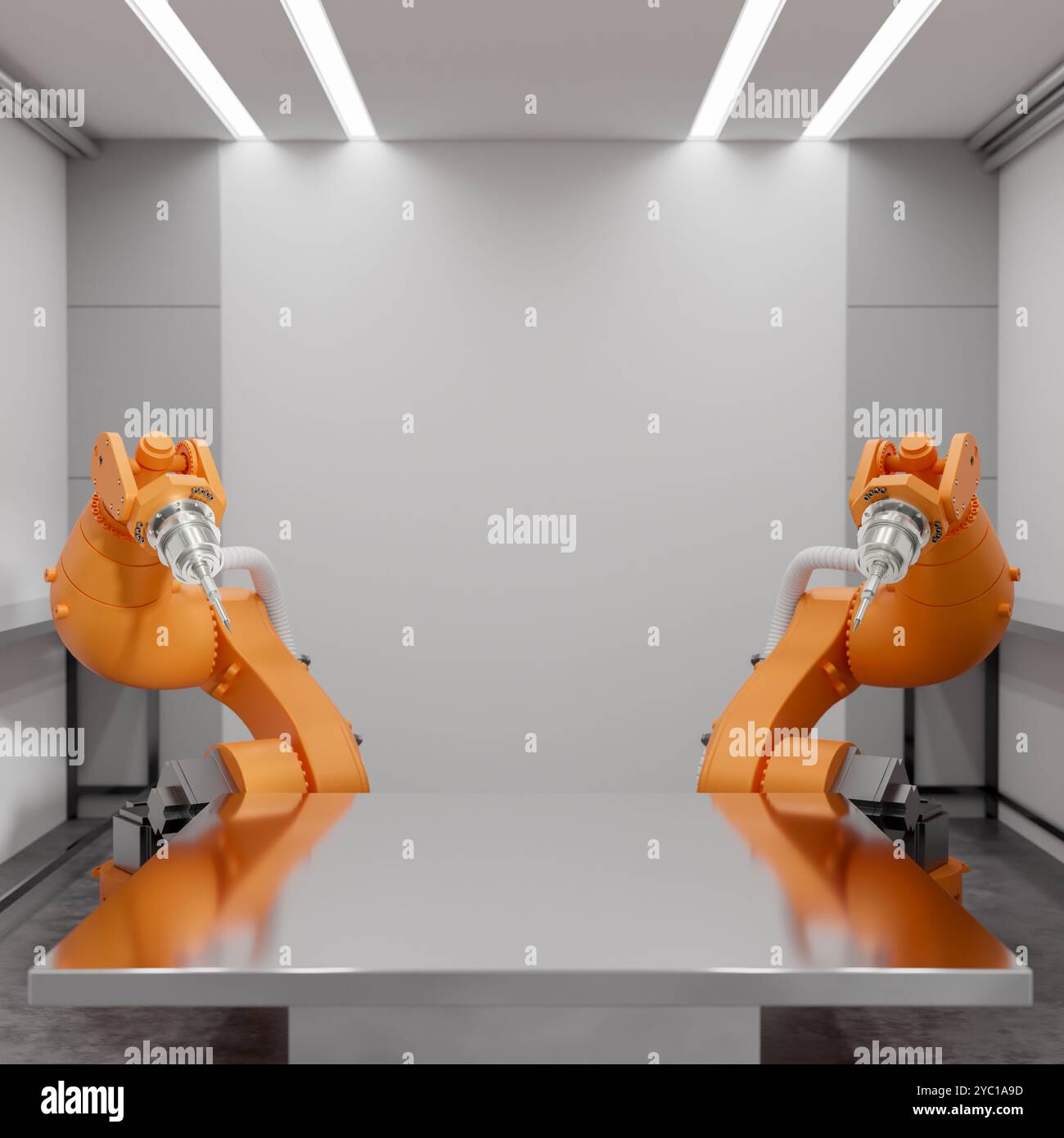 Un espace pour exposer des produits sur une surface de table métallique avec des bras robotisés qui l'entourent dans une usine moderne. Fabrication automatisée. technologie Banque D'Images