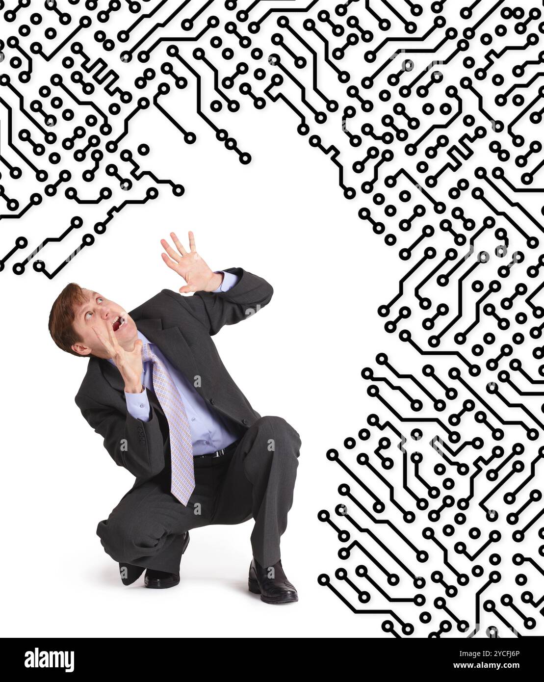 L'électronique dévore l'homme effrayé Banque D'Images