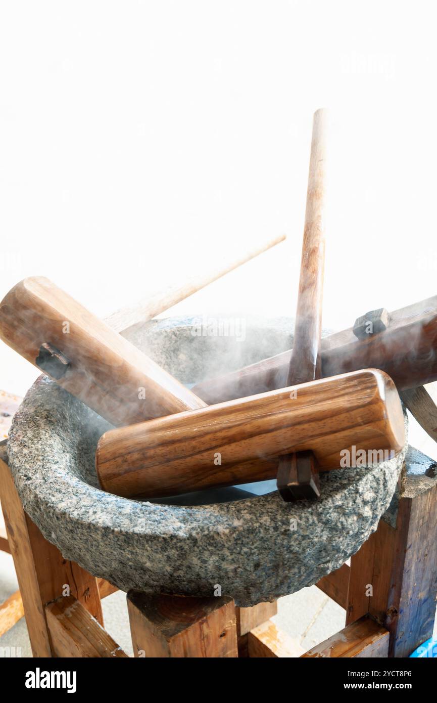 Mortier et pilon de pierre chauffés Banque D'Images
