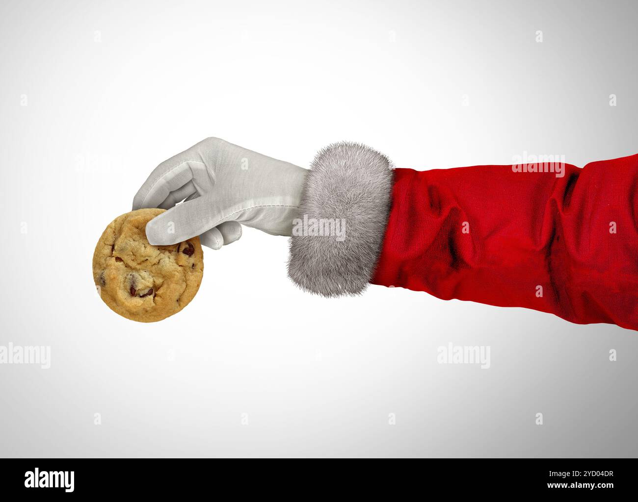 Collation de Noël et célébration de la saison hivernale comme le Père Noël et les santaclas tenant un biscuit aux pépites de chocolat comme fête du nouvel an saisonnier Banque D'Images