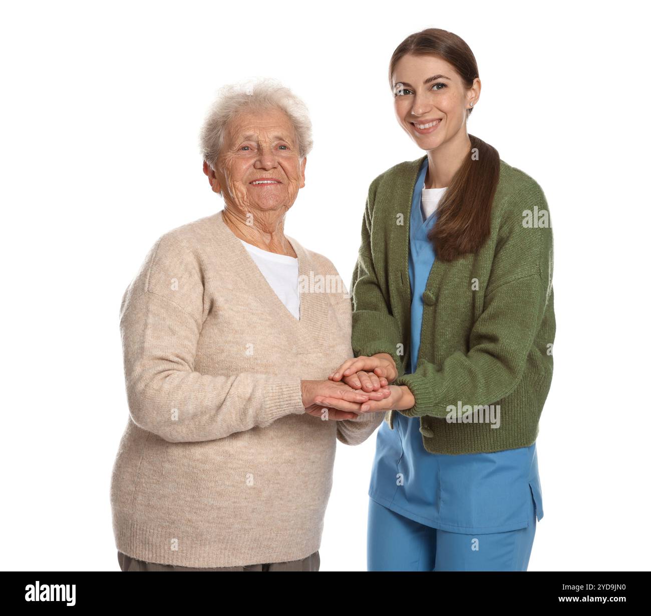 Soignant soutenant la femme âgée sur fond blanc. Service de soins à domicile Banque D'Images