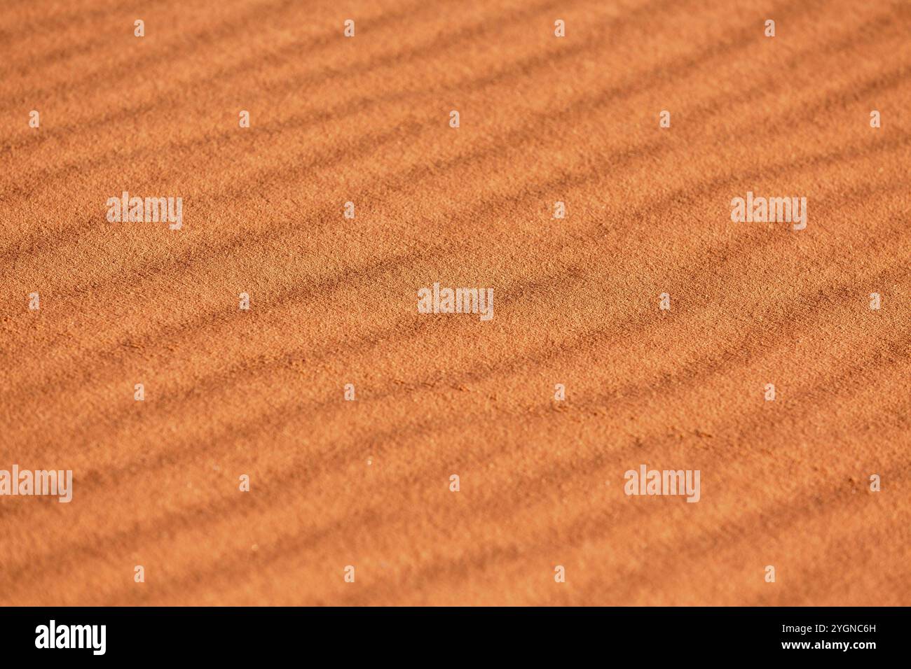 Fond de texture orange de dune de sable du désert, gros plan Banque D'Images