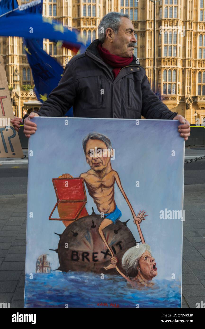 Londres, Royaume-Uni. 22 novembre 2017. Les manifestations contre le Brexit devant le Parlement se sont poursuivies le jour du budget avec de nouveaux slogans pour l'occasion, "What's the budget for Brexit" et "Brexit spreads Sheet Everywhere", une référence au surnom de la chancelière "Spreadsheet Phil". En plus des drapeaux européens, ils ont des drapeaux de l'Union à l'envers, traditionnellement un signe de détresse, même s'il est plutôt discret. Ils ont été brièvement rejoints par l'artiste politique Kaya Mar avec son image du chancelier assis sur une mine flottante avec son ordinateur tenant en main une Theresa May en train de couler alors que le navire britannique coule en arrière-plan Banque D'Images