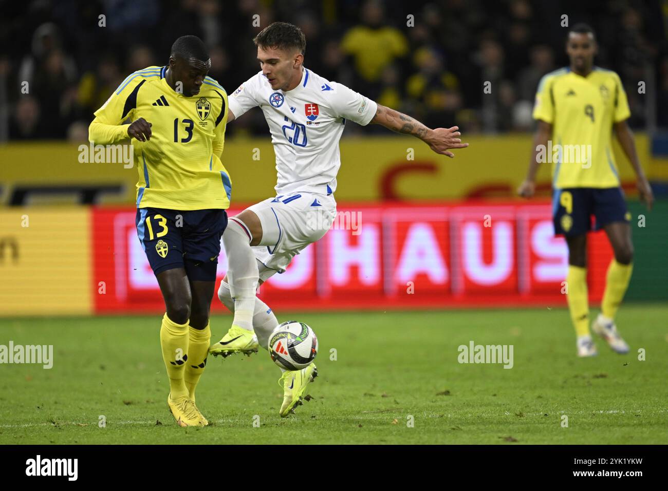 Sweden's Ken Sema, left, and Slovakia's Dávid Duris in action during the UEFA Nations League group C1 soccer match between Sweden and Slovakia at Strawberry Arena in Stockholm, Sweden, Saturday Nov. 16, 2024. (Pontus Lundahl/TT News Agency via AP) Banque D'Images