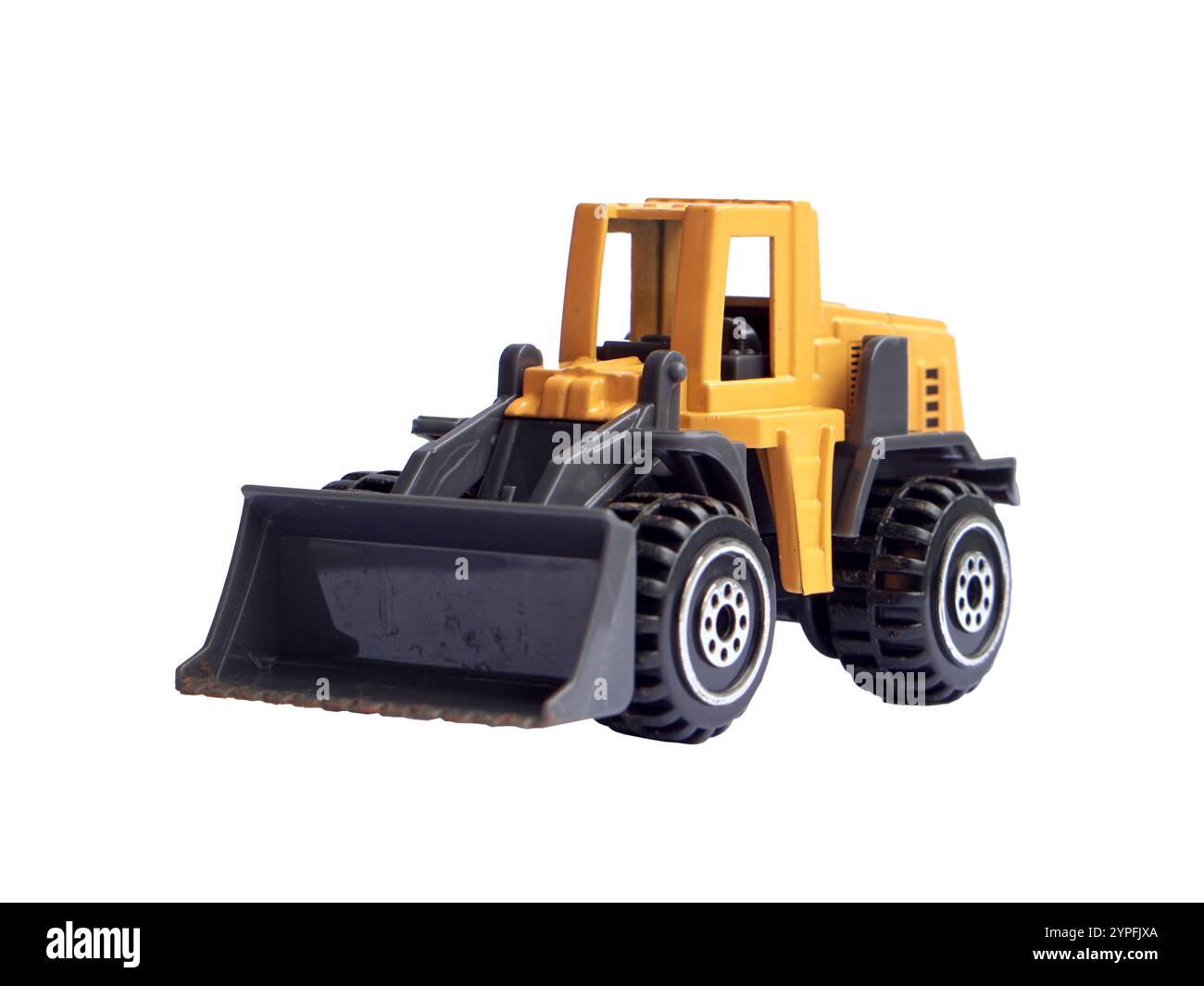 bulldozer jouet jaune isolé sur fond blanc, modèle de machinerie lourde ou moulé sous pression. Banque D'Images