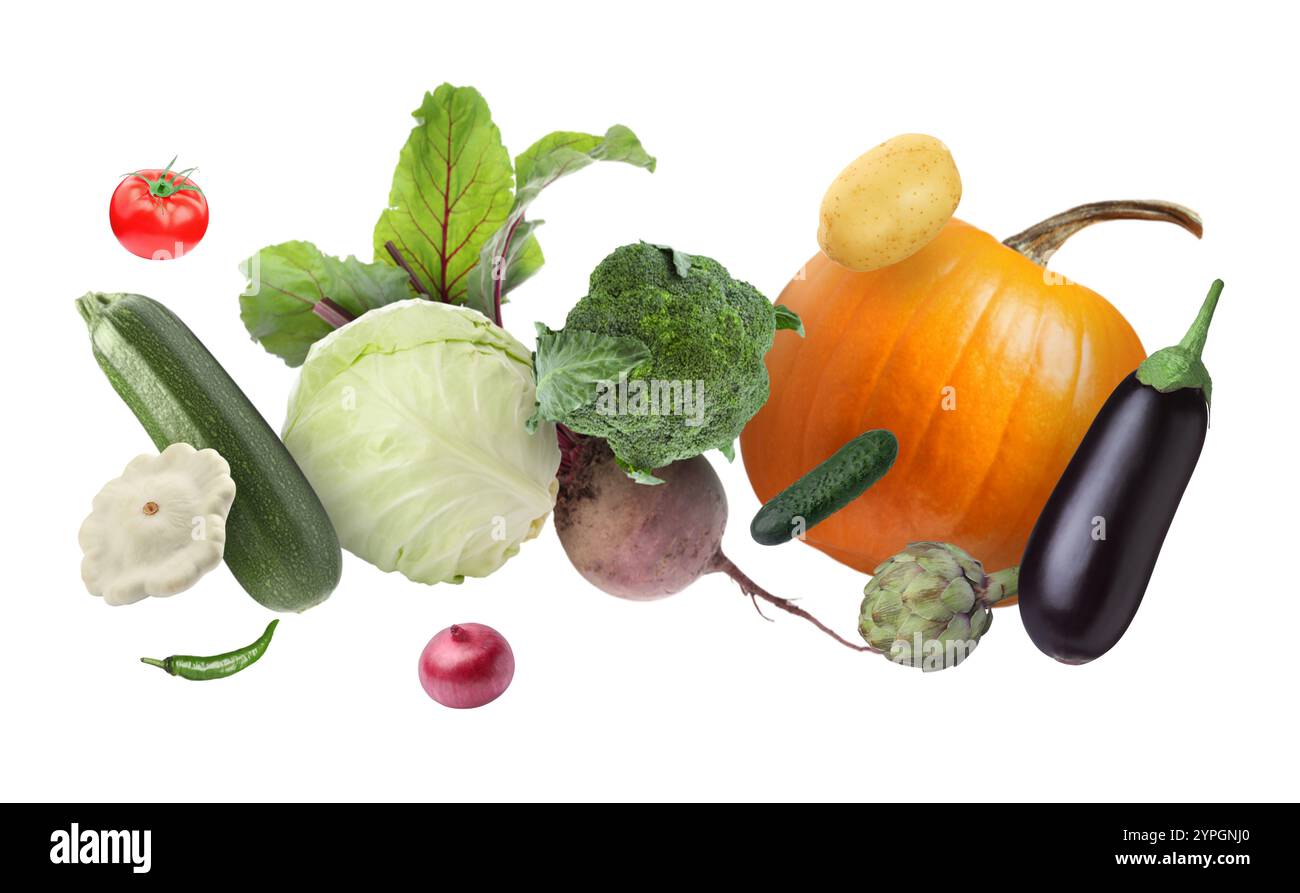 Différents légumes frais dans l'air sur fond blanc Banque D'Images