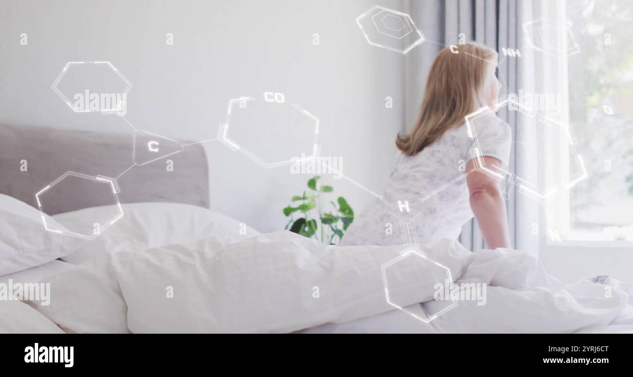 Image du traitement des données scientifiques sur une femme caucasienne en lit d'hôpital Banque D'Images