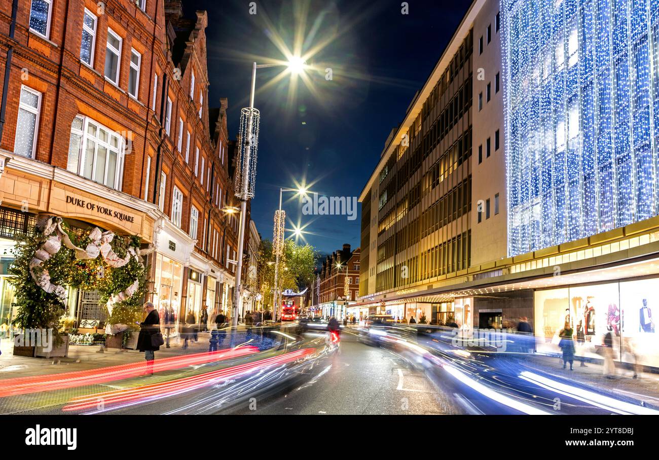 Kings Road à Noël la nuit Chelsea Londres Royaume-Uni Banque D'Images