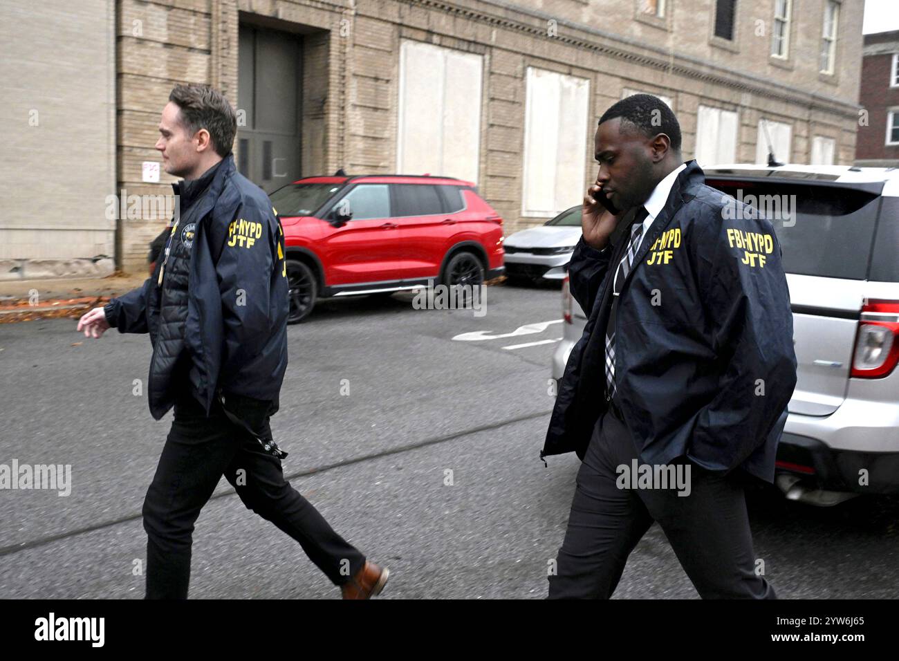 Members of a Joint Task Force with the FBI and the NYPD exit the