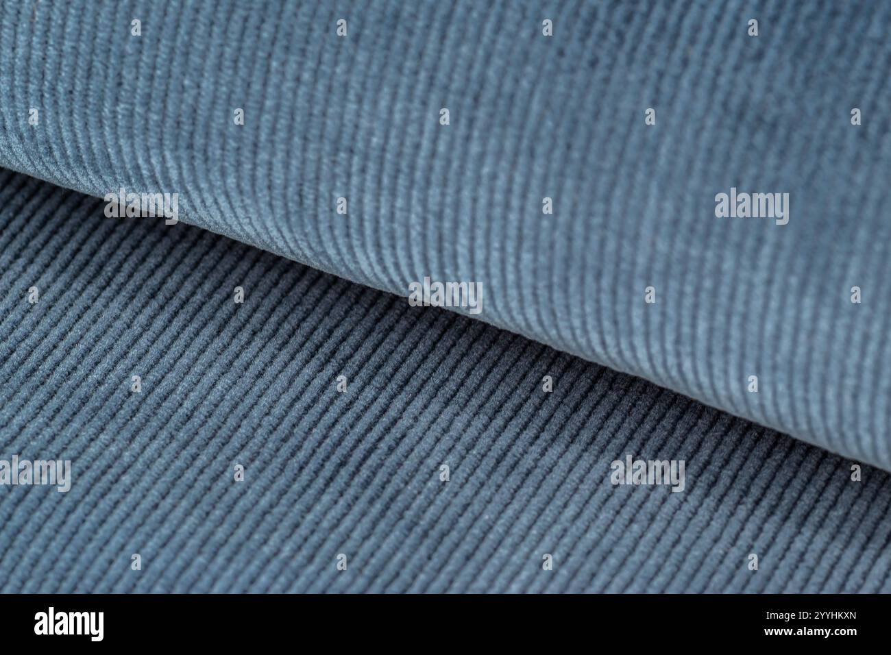 Motifs de tissu velours côtelé texturé bleu gros plan comme fond textile Banque D'Images