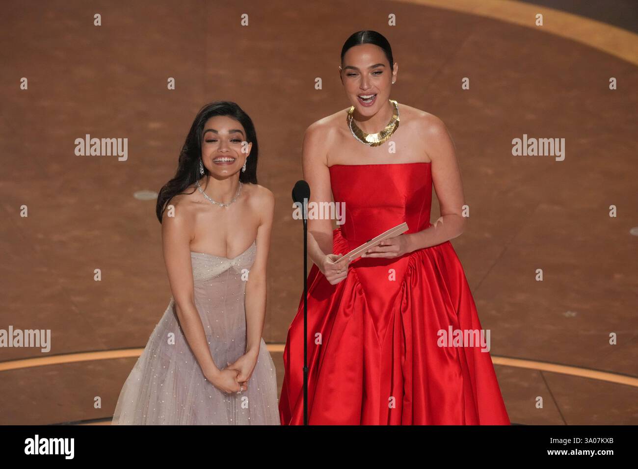 Rachel Zegler, left, and Gal Gadot present the award for best visual ...