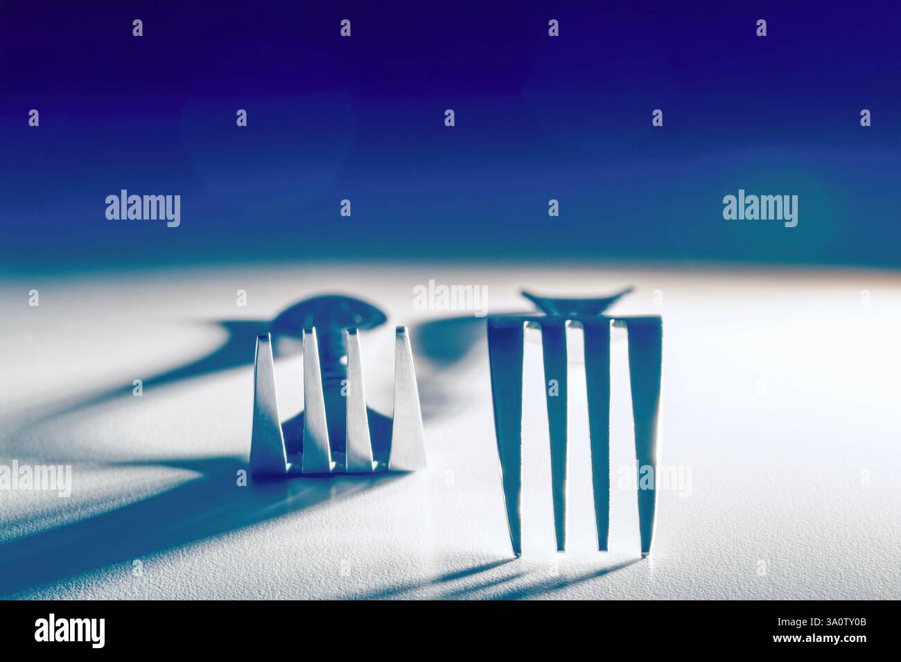 Image abstraite de fourches sur un fond blanc avec dégradé bleu et vert Banque D'Images