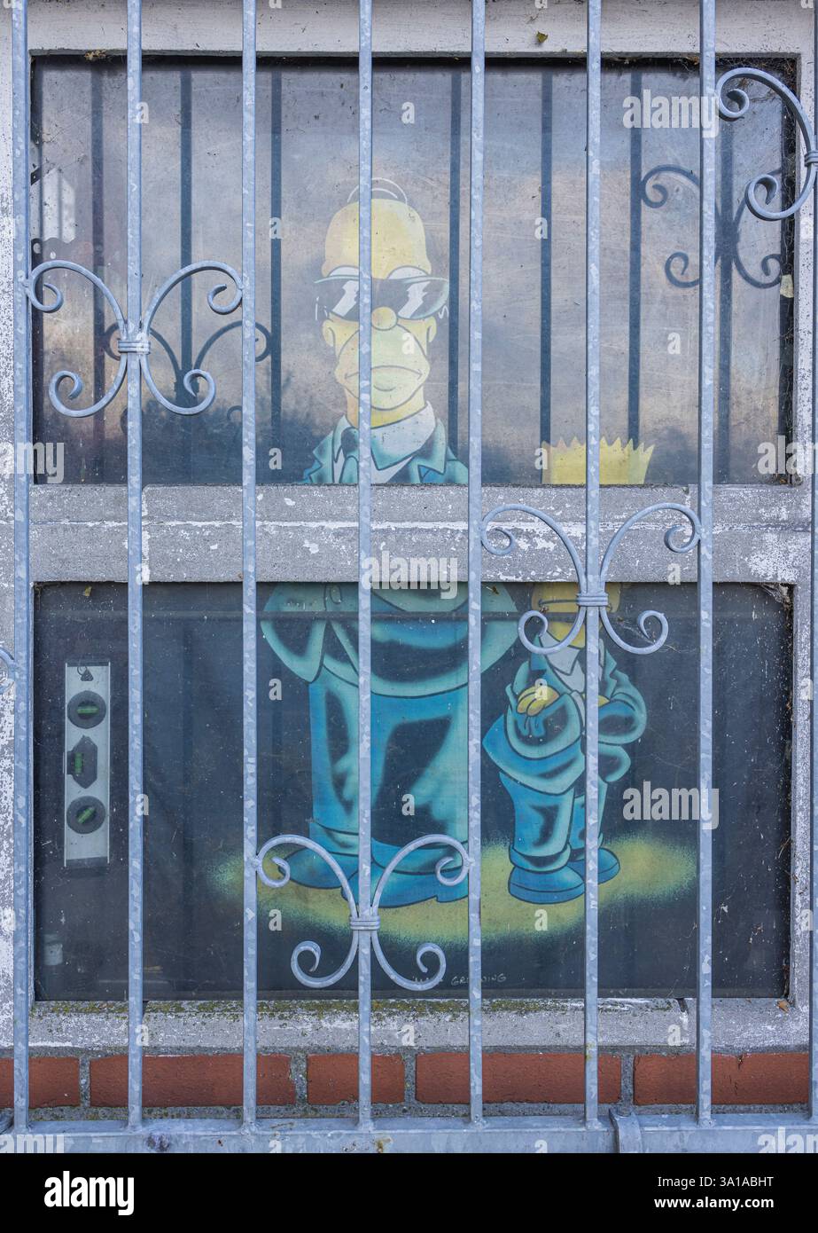 Windows, Homer et Bart Simpsons derrière les barreaux Banque D'Images