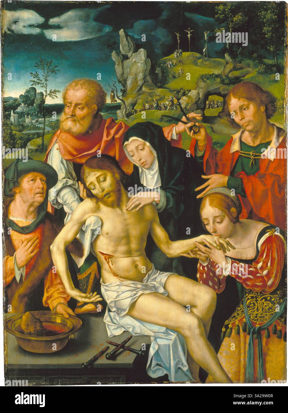 La Lamentation du Christ de Joos van Cleve (1524) représente le corps du Christ en deuil, entouré de figures tristes, rendues dans le style de la haute Renaissance avec une expression émotionnelle vive. Banque D'Images