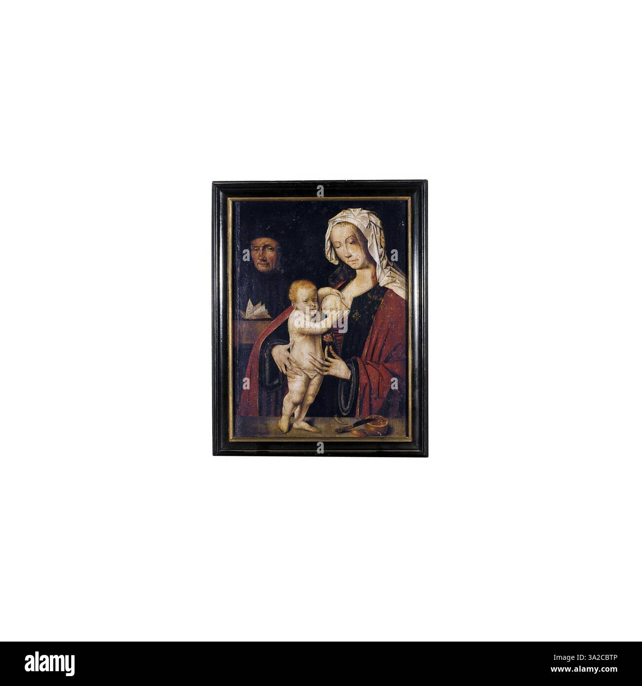 Cette peinture du XVIe siècle, attribuée à un disciple de Joos van Cleve, représente la Sainte famille. La composition capture Marie, Joseph et le Christ enfant, en mettant l'accent sur leur relation sacrée et l'atmosphère sereine et dévotionnelle de la scène. Banque D'Images