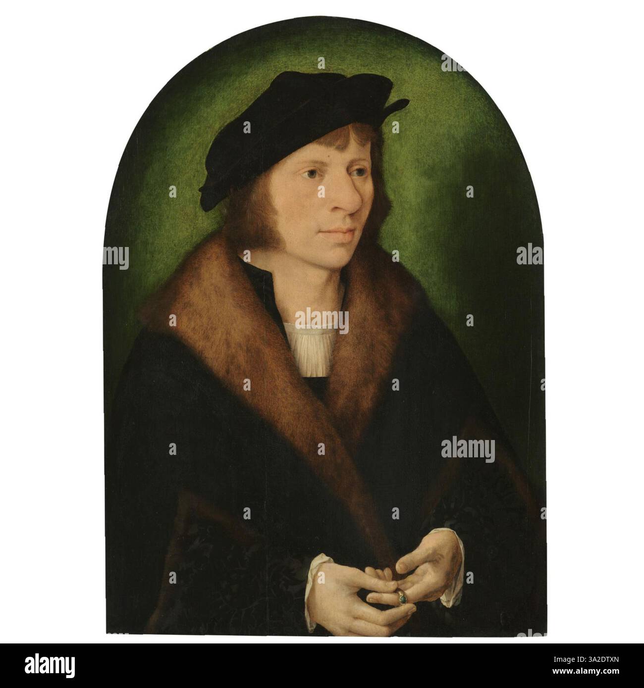 Ce portrait de Joos van Cleve, réalisé entre 1518 et 1520, présente un jeune homme vêtu d’une casquette noire et d’un manteau garni de fourrure. L’expression détaillée et l’utilisation de la lumière reflètent l’expertise de l’artiste dans la capture de la personnalité et du statut social. Banque D'Images