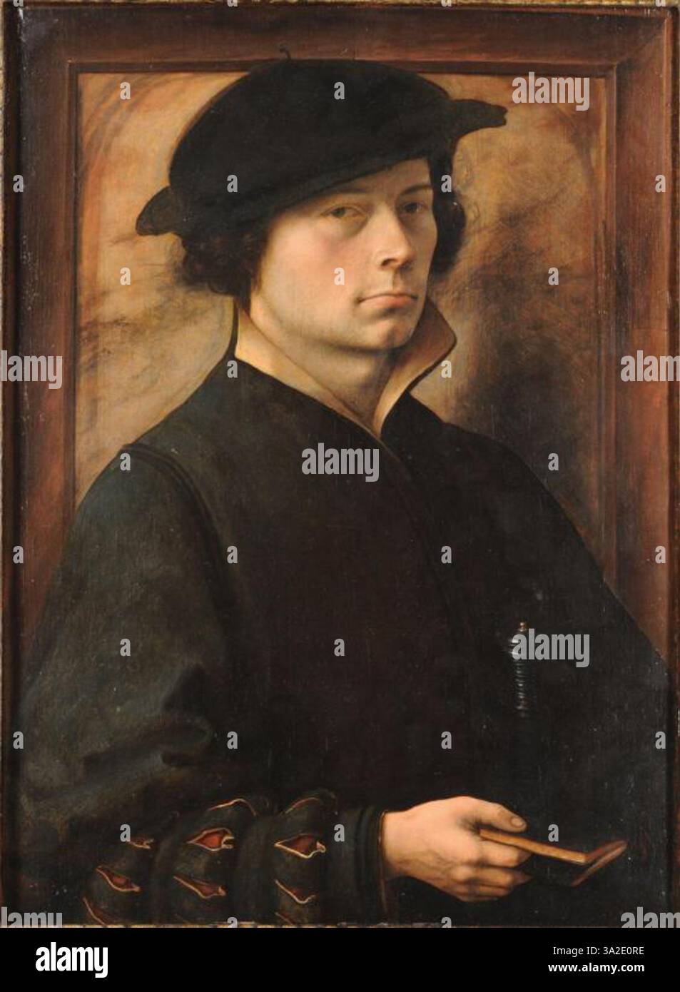 Un portrait du cercle de Gossaert, montrant un homme inconnu des environs de 1520. Les vêtements riches et le comportement calme du sujet sont indicatifs de sa position sociale élevée et de l'habileté de l'artiste à capturer le caractère et la tenue vestimentaire. Banque D'Images