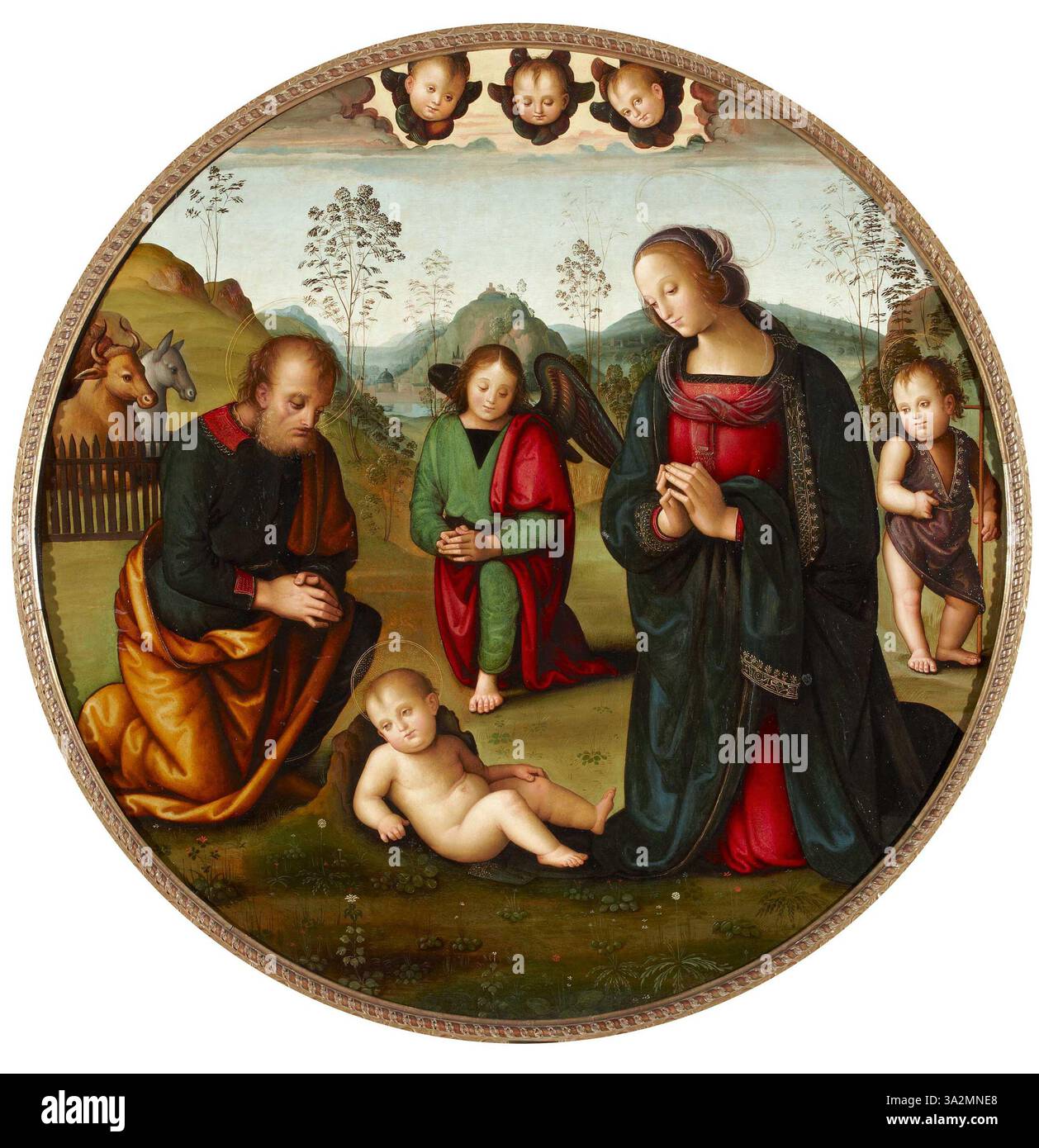'La Adoración del Niño' de Pietro Perugino représente l'adoration du Christ en bas âge. L'œuvre montre un moment serein et dévotionnel avec des figures détaillées et des couleurs riches et harmonieuses. Banque D'Images