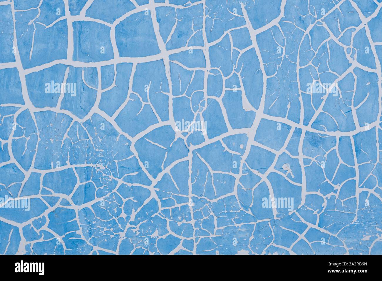 Peinture bleue fissurée sur le mur. Fond abstrait pour la conception Banque D'Images