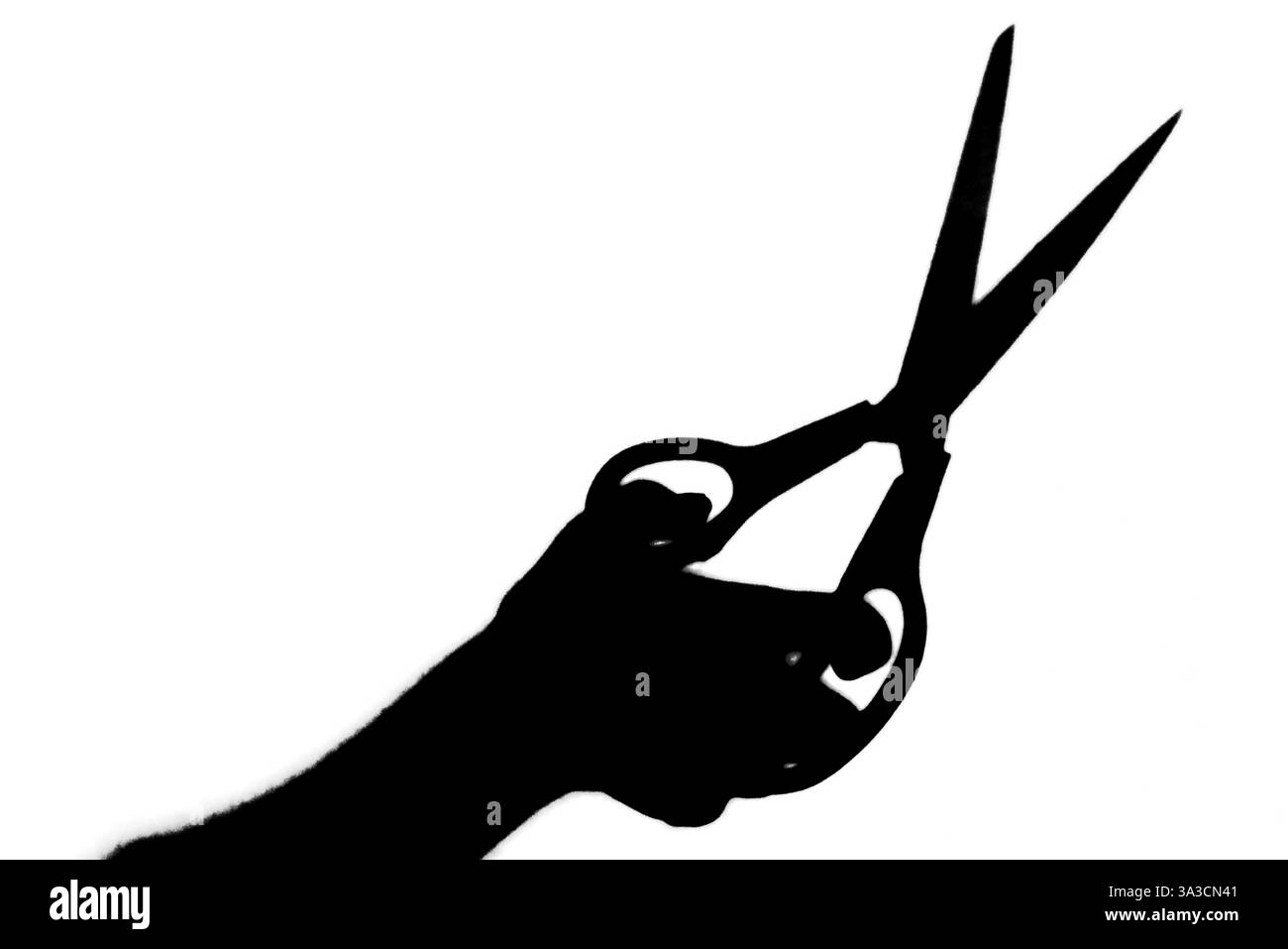 Silhouette, silhouette noire et blanche, ciseaux tenant la main Banque D'Images