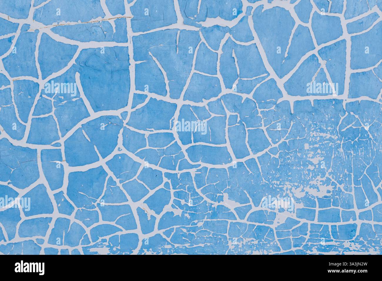 Peinture bleue fissurée sur le mur. Fond abstrait et texture pour la conception Banque D'Images