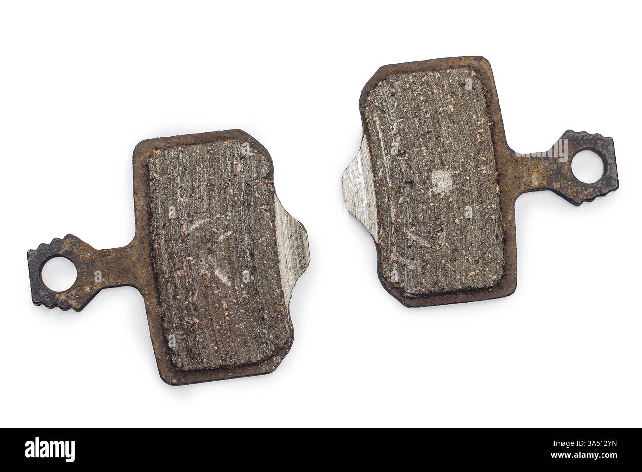 Plaquettes de frein de vélo usées sur fond blanc Banque D'Images