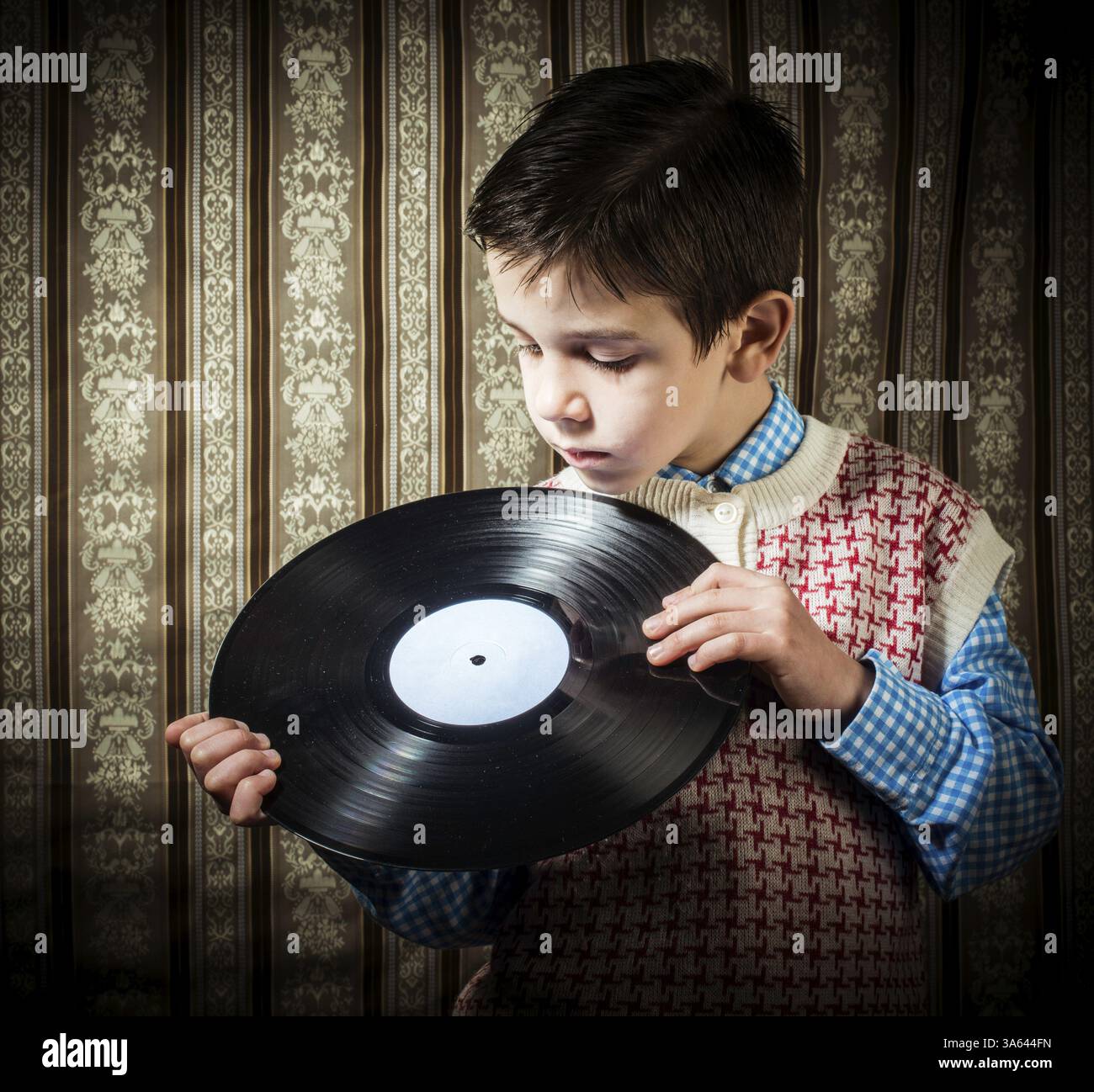 Maintenez l'enfant lp. Vontage vêtements Banque D'Images